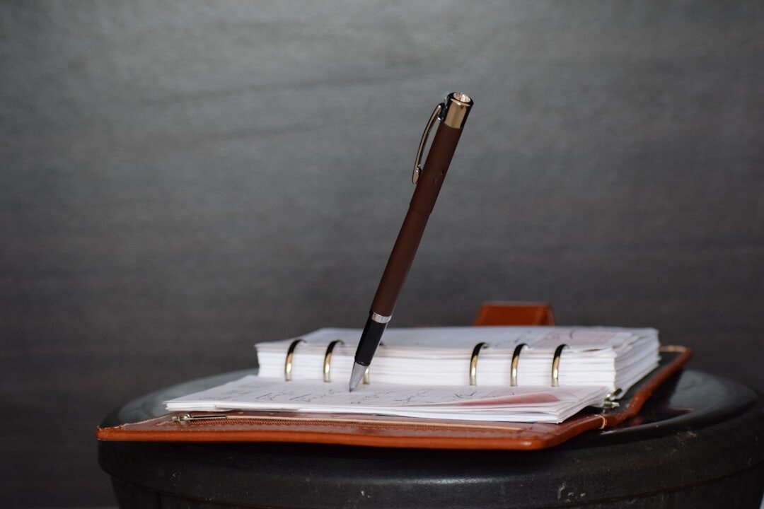 Will document and pen on desk
